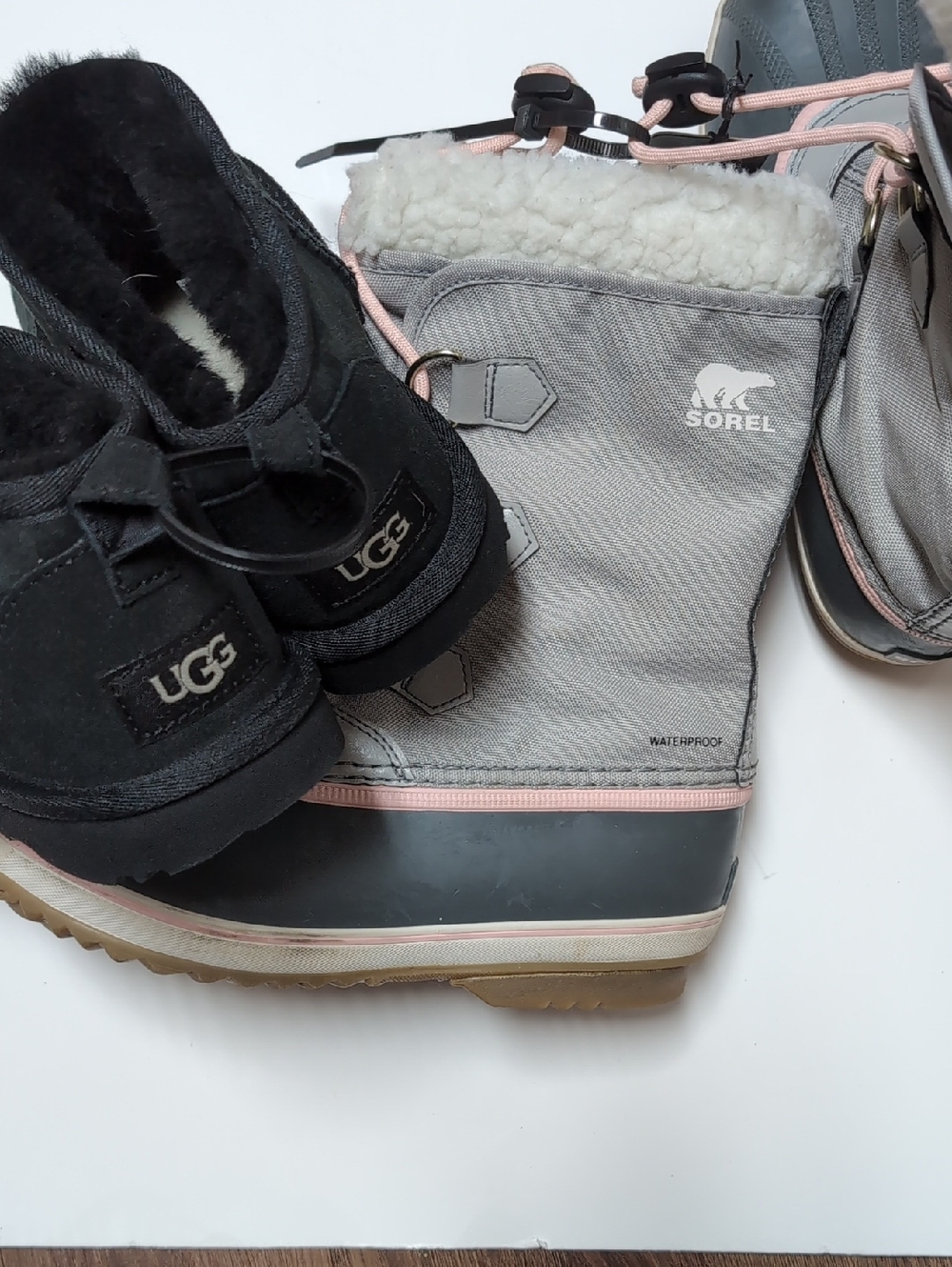 UGG Black Shearling Slip-Ons with Grey & Pink Sorel Winter Boots